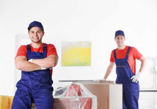 Removal team handling boxes during a property move