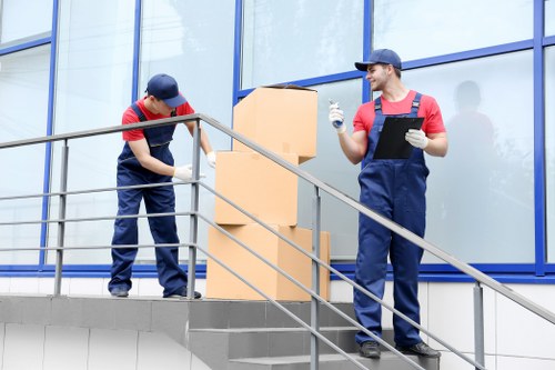 Removal crew wearing PPE and working safely