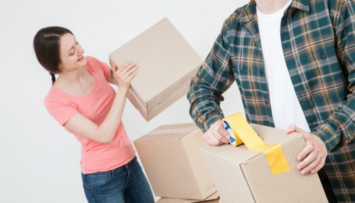 Trained removal staff carrying furniture with care