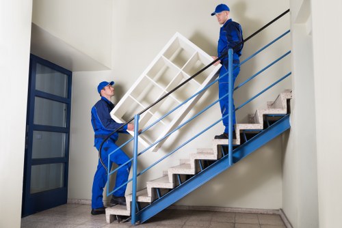 Professional movers handling boxes and furniture with care