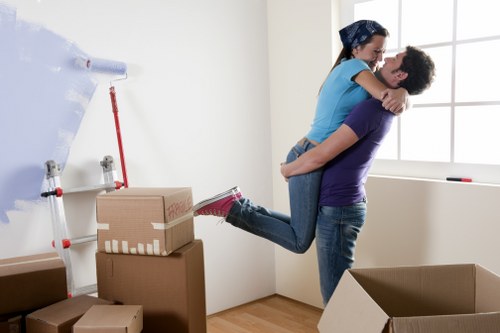 Moving team handling household items in a central London property