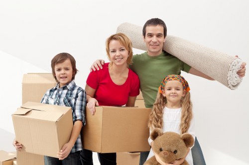 Cubic-yard moving rate concept with stacked boxes and sofa